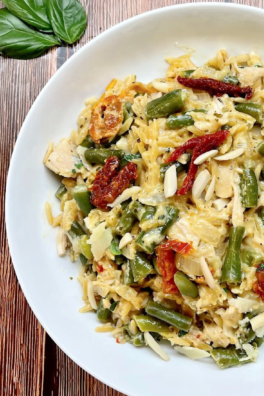 A big beautiful bowl of Pesto Orzo pasta ready to be eaten. 