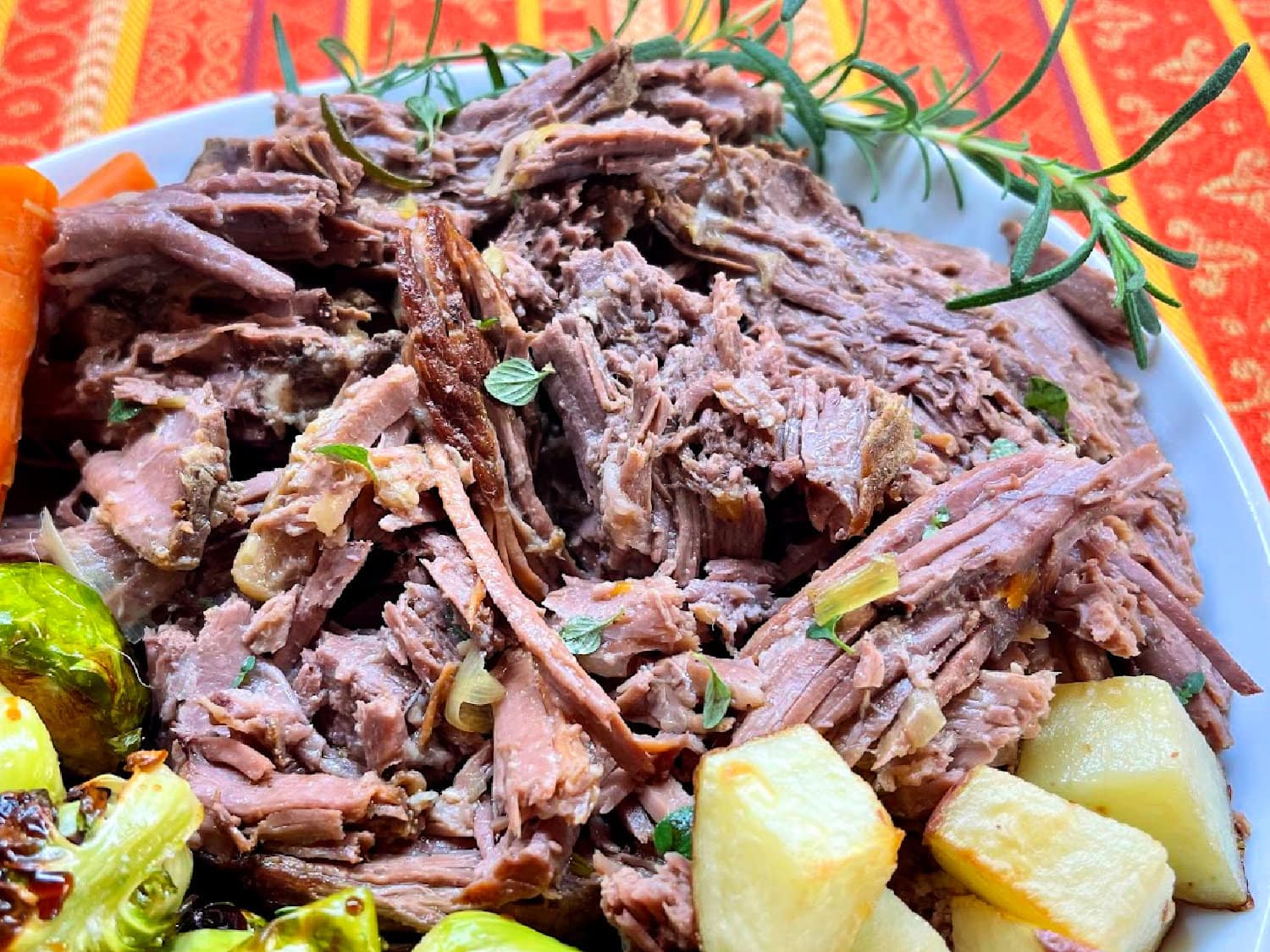 Slow-Braised Rump Roast ready to be enjoyed with potatoes and carrots. 