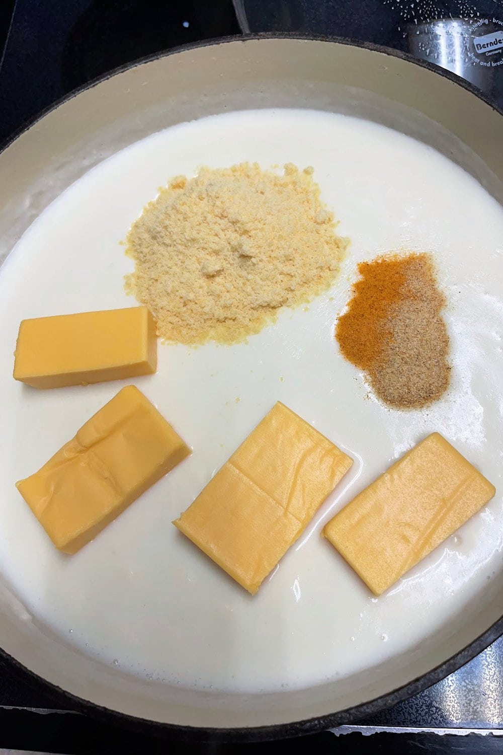 Cheeses and spices added to the sauce.