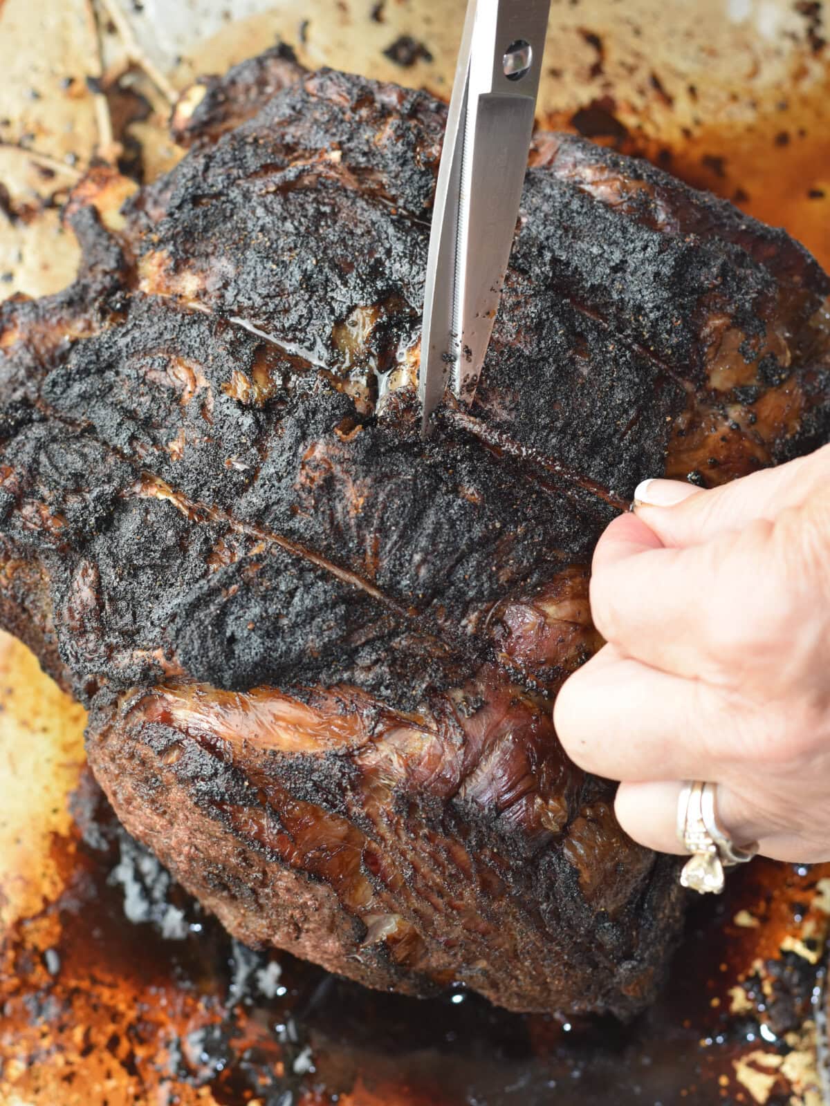 500-Rule-Prime-Rib-Strings Cutting the strings on a piece of beef.