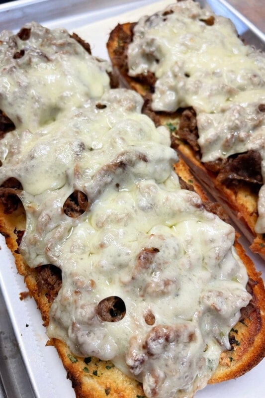 Melted cheese over shaved beef on Italian bread. 