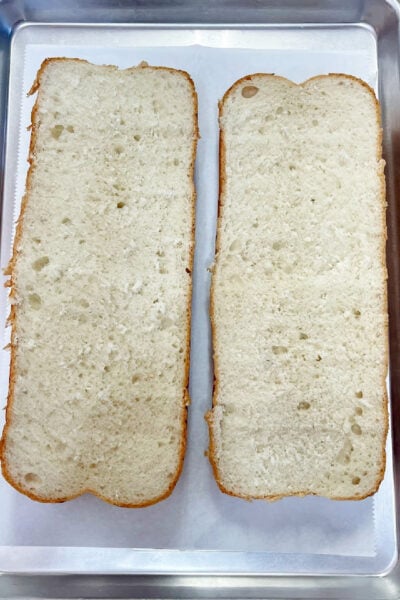 A loaf of Italian bread sliced in half horizontally. 