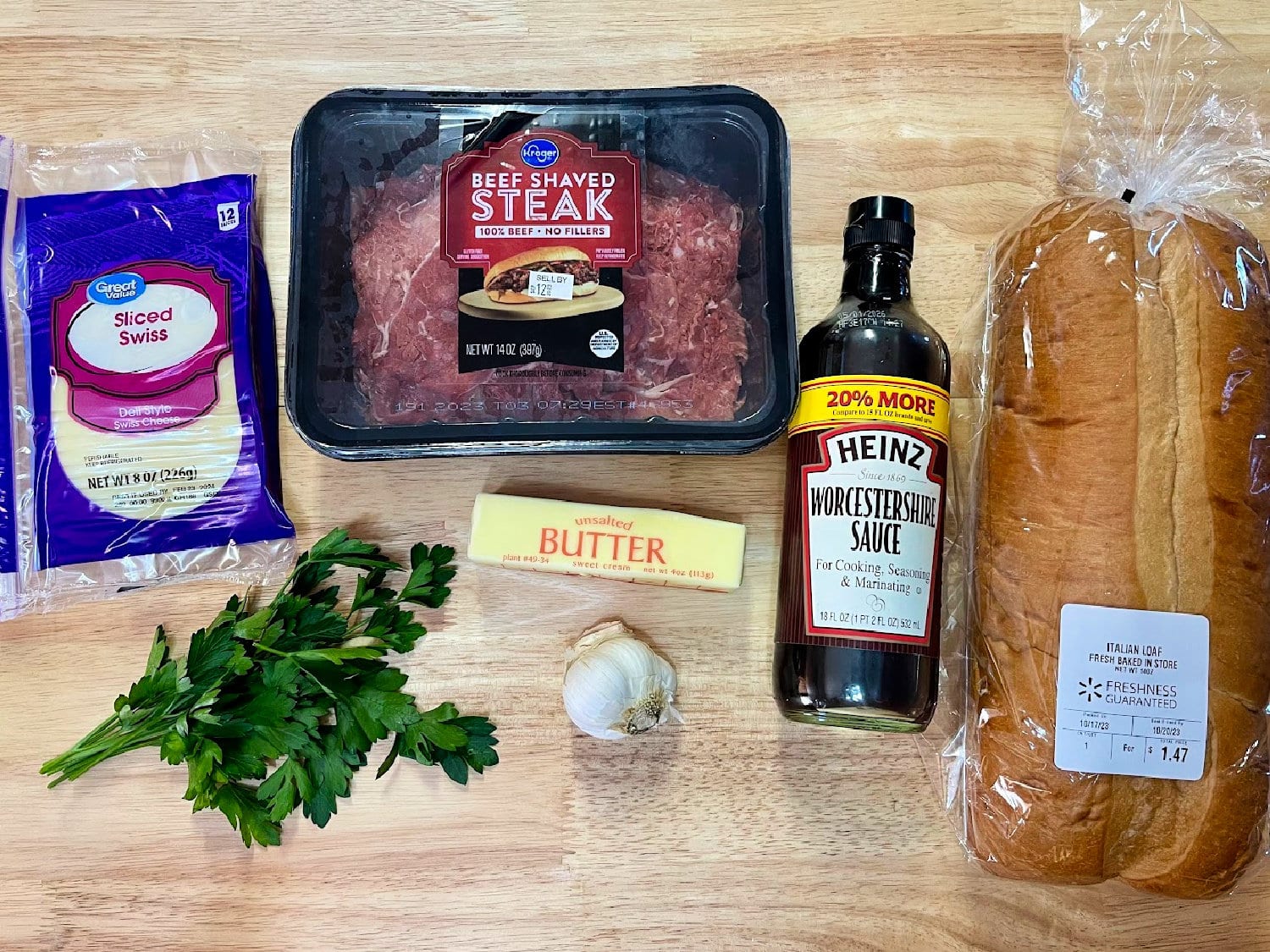 All the ingredients needed for shaved steak sandwiches. 