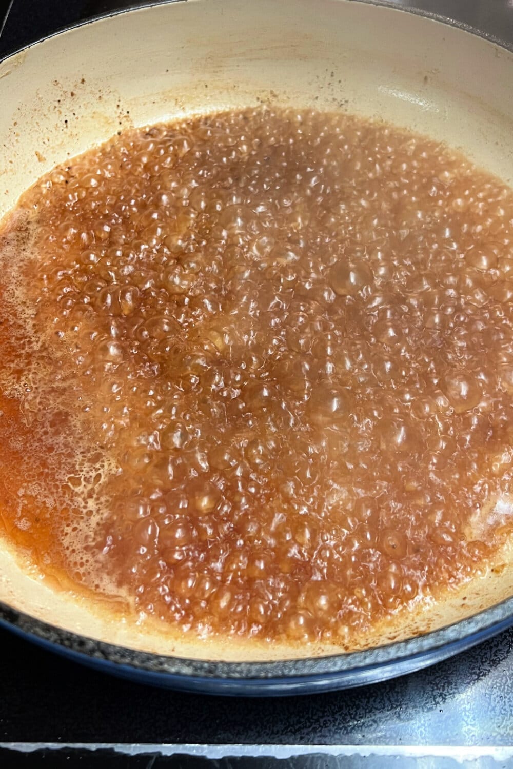 Simmer broth in a skillet to deglazed the bottom. 