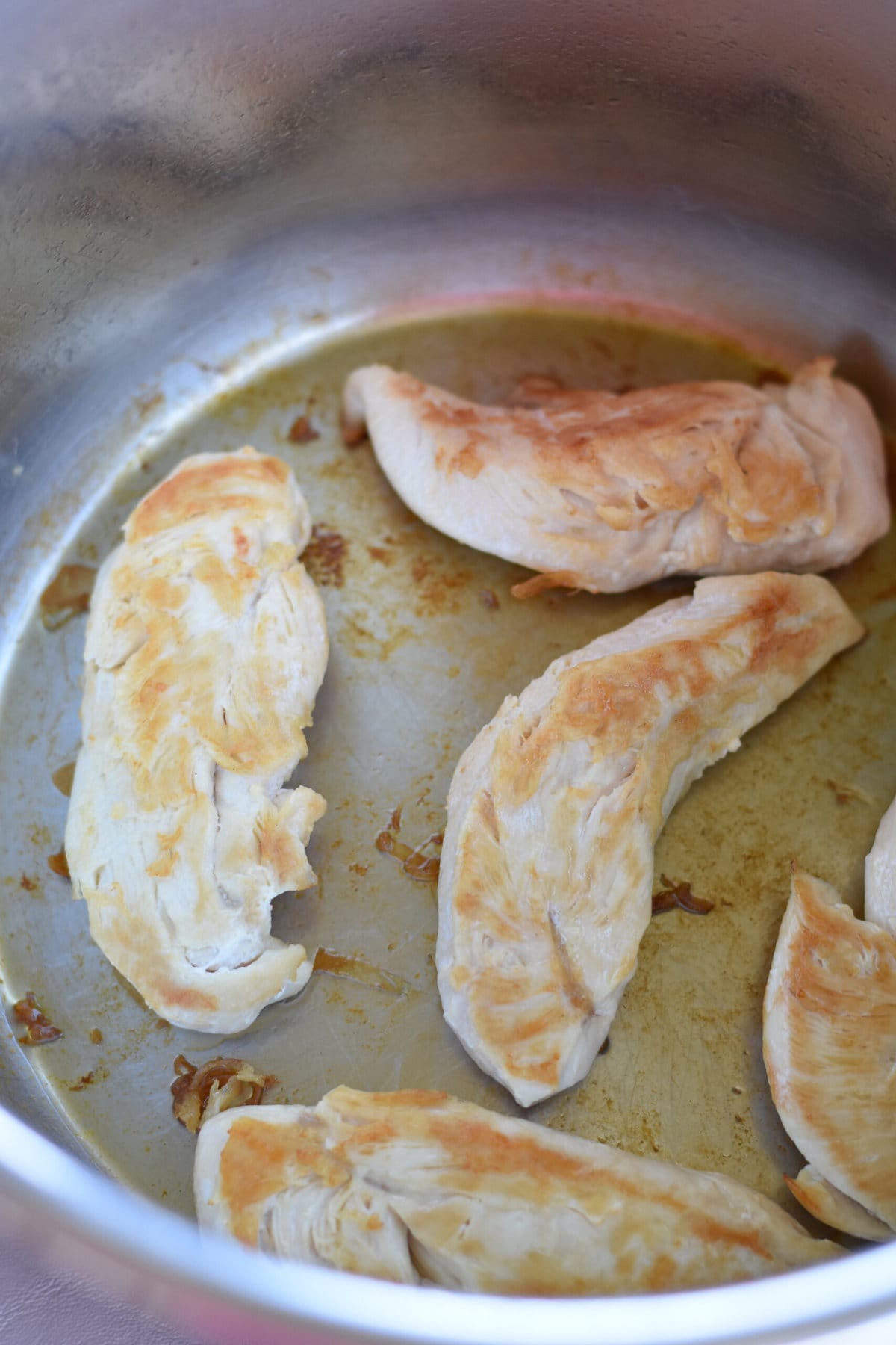 Browning the chicken tenders on the sauté setting of the Instant Pot. 