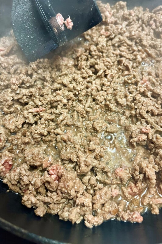 Browned ground beef in a skillet. 