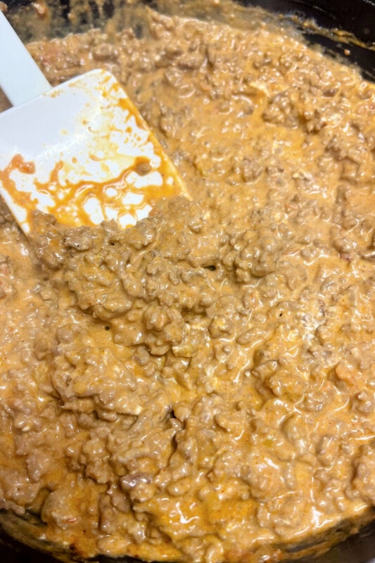 Creamy ground beef mixture for walking taco casserole. 