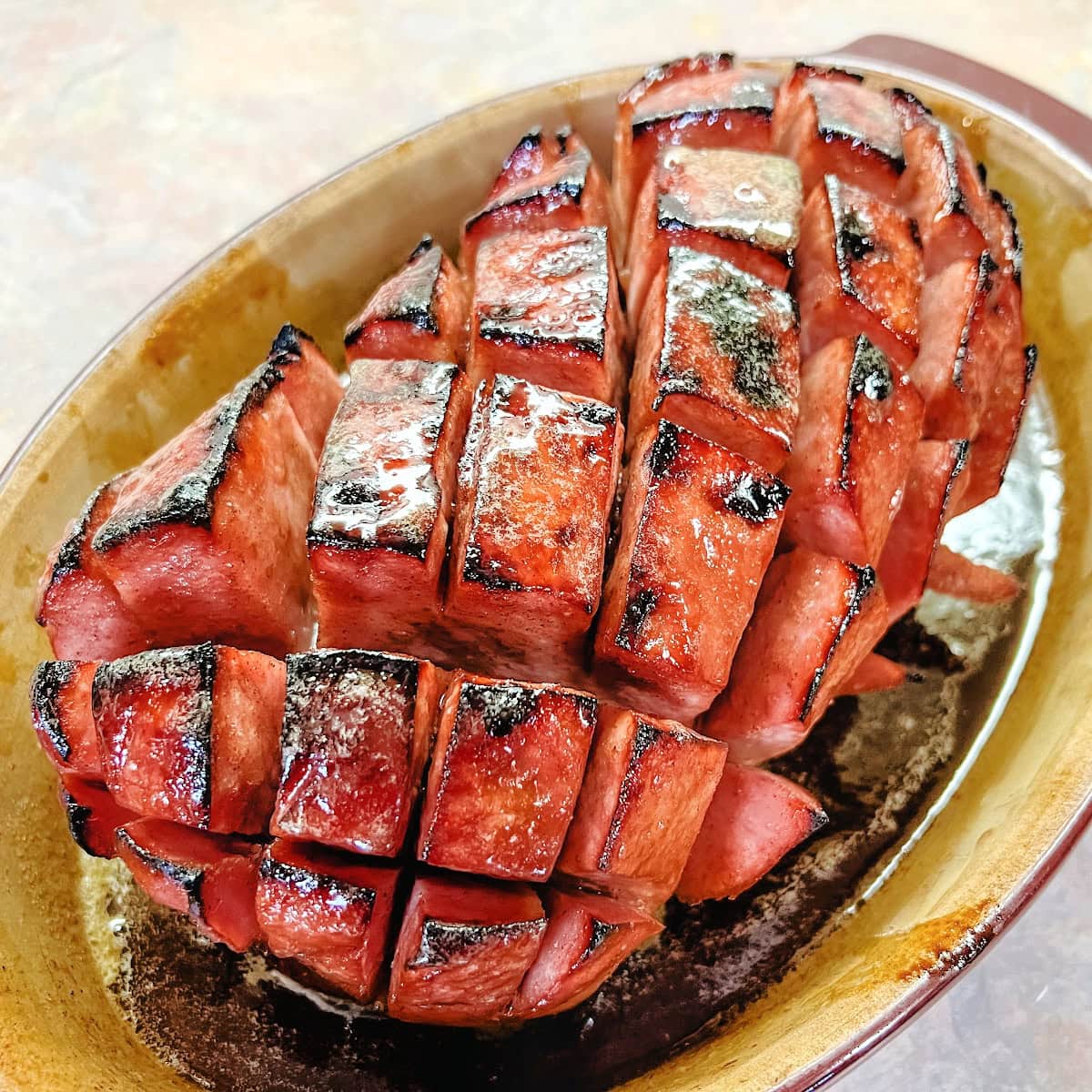 A fully cooked boneless baked ham made in the oven.