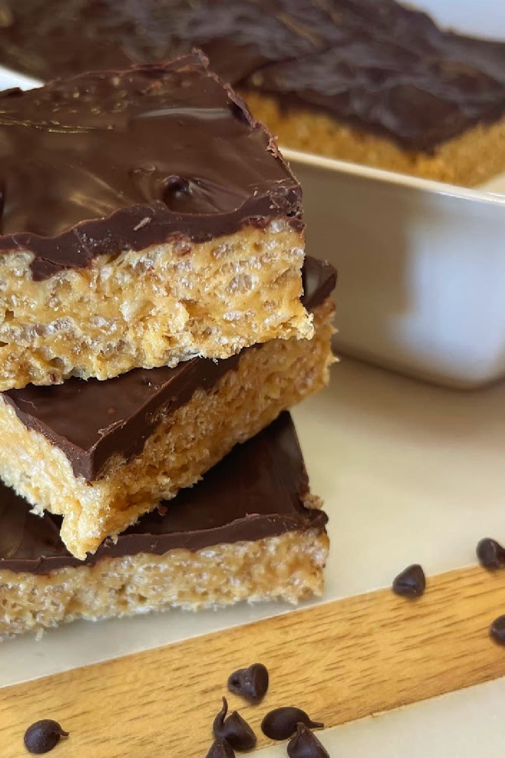 A triple stack of Chocolate Covered Rice Krispie Treats. 