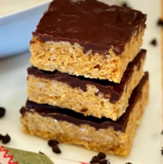 A triple stack of ooey ooey chocolate covered rice krispie treats.