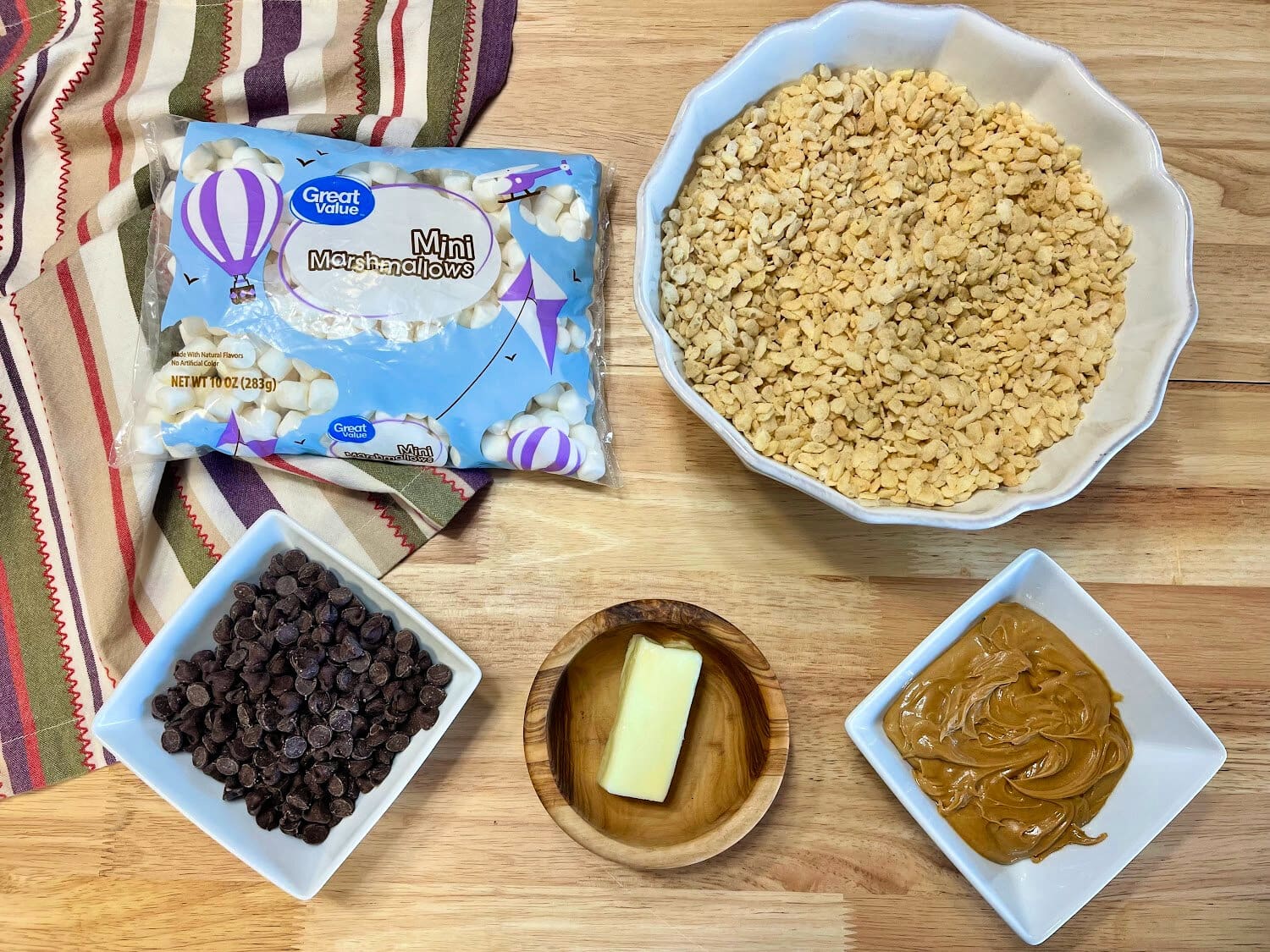 All the ingredients needed to make chocolate covered rice krispie treats. 