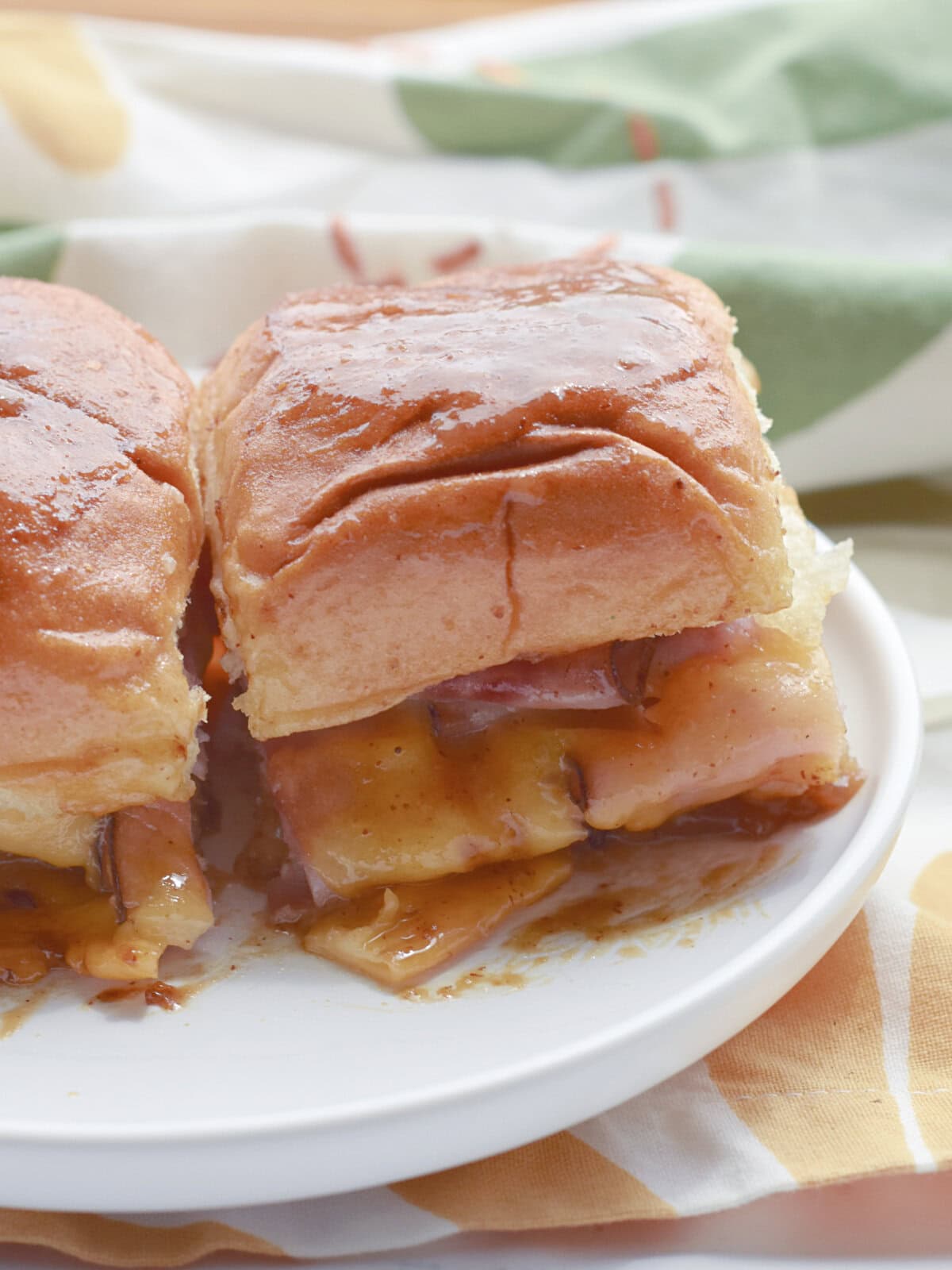 Ham and Cheese sliders on a serving plate.