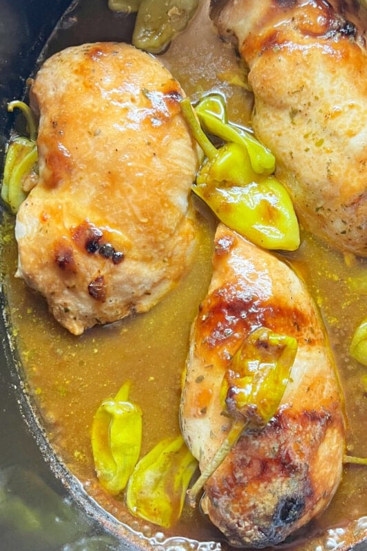 Whole Mississippi Chicken breasts in a slow cooker. 