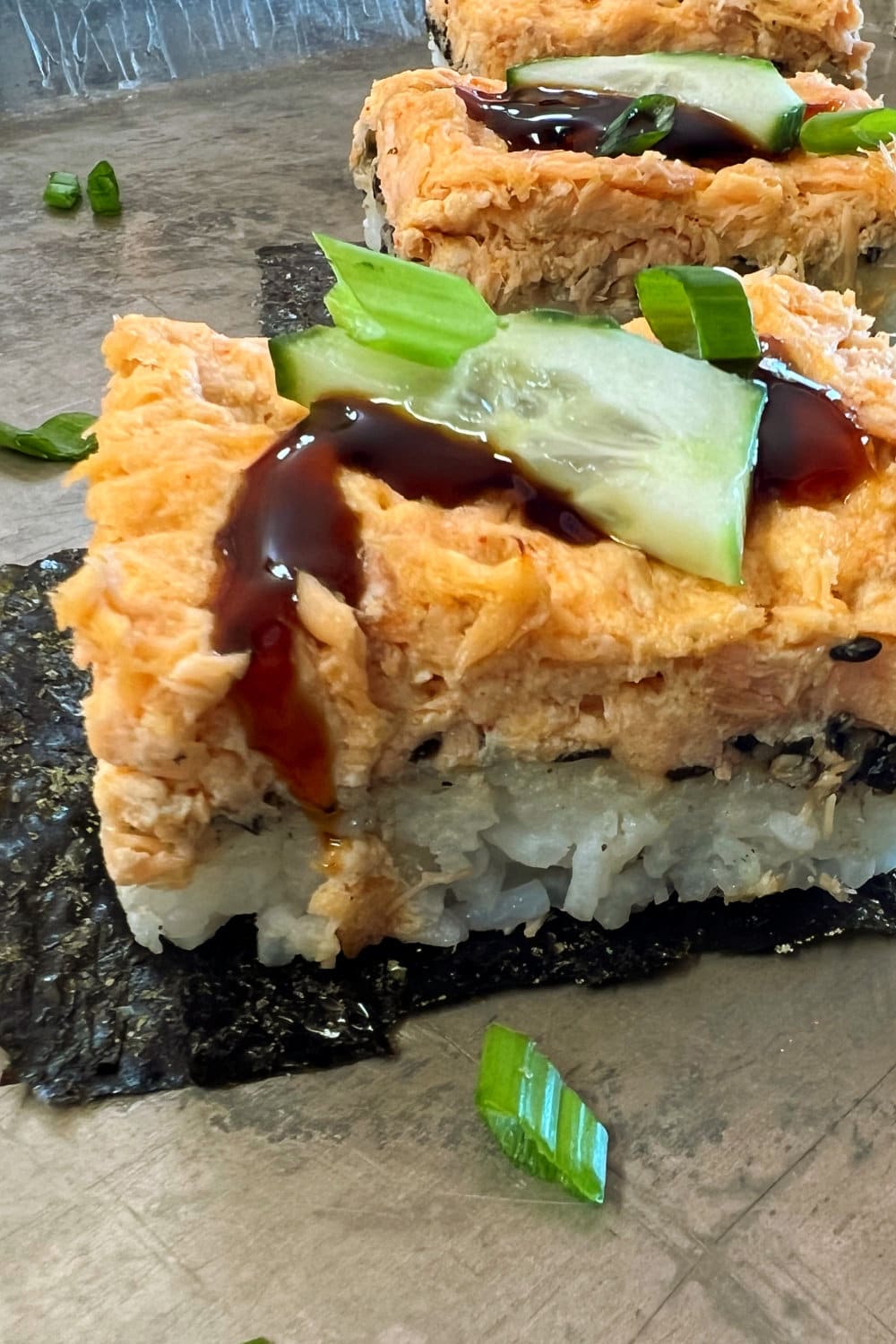 Salmon Sushi Bake squares on a serving platter. 