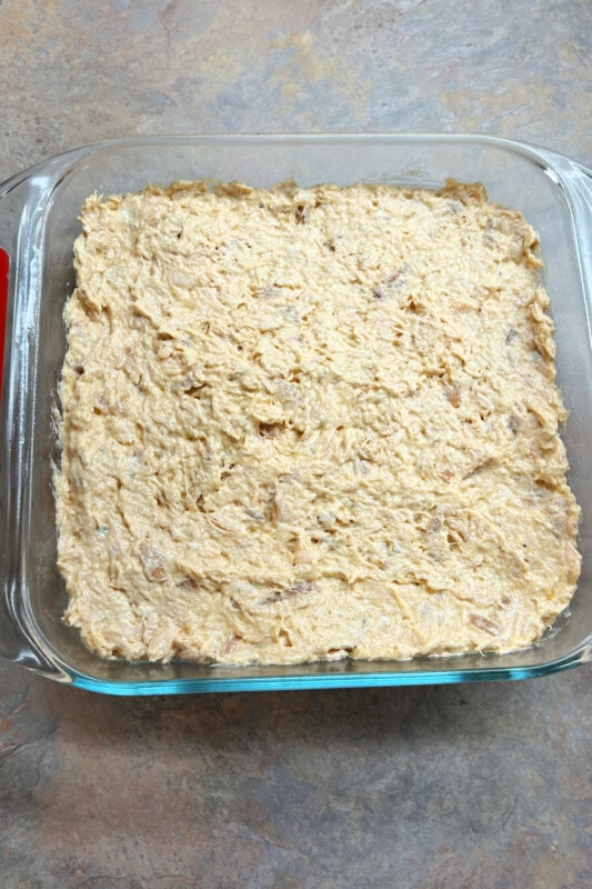 Salmon cream cheese mixture spread over the rice layer for sushi bake. 