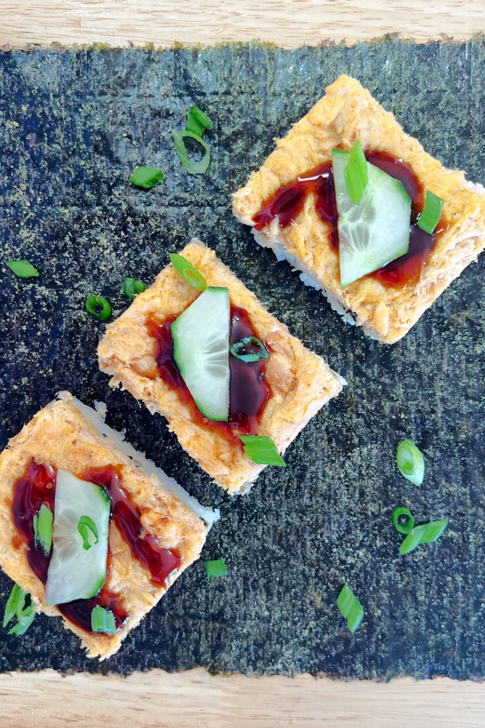 A trio of salmon sushi bake squares, ready to be enjoyed.