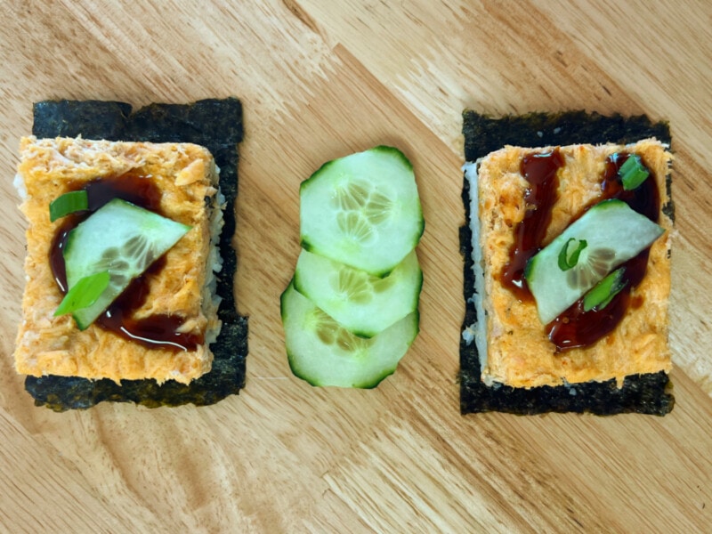 Two squares of Salmon Sushi Bake served on nori paper. 