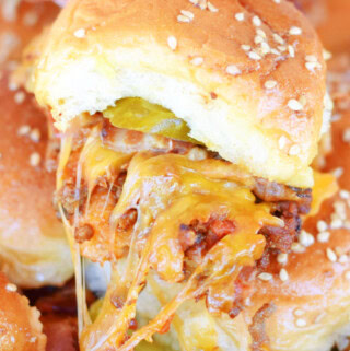 A Bacon Cheeseburger Slider with lots of stringy cheese.