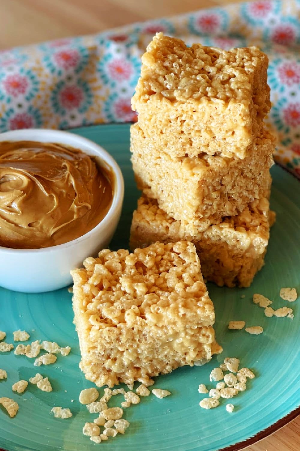 Peanut butter rice krispie treats on a blue plate. 