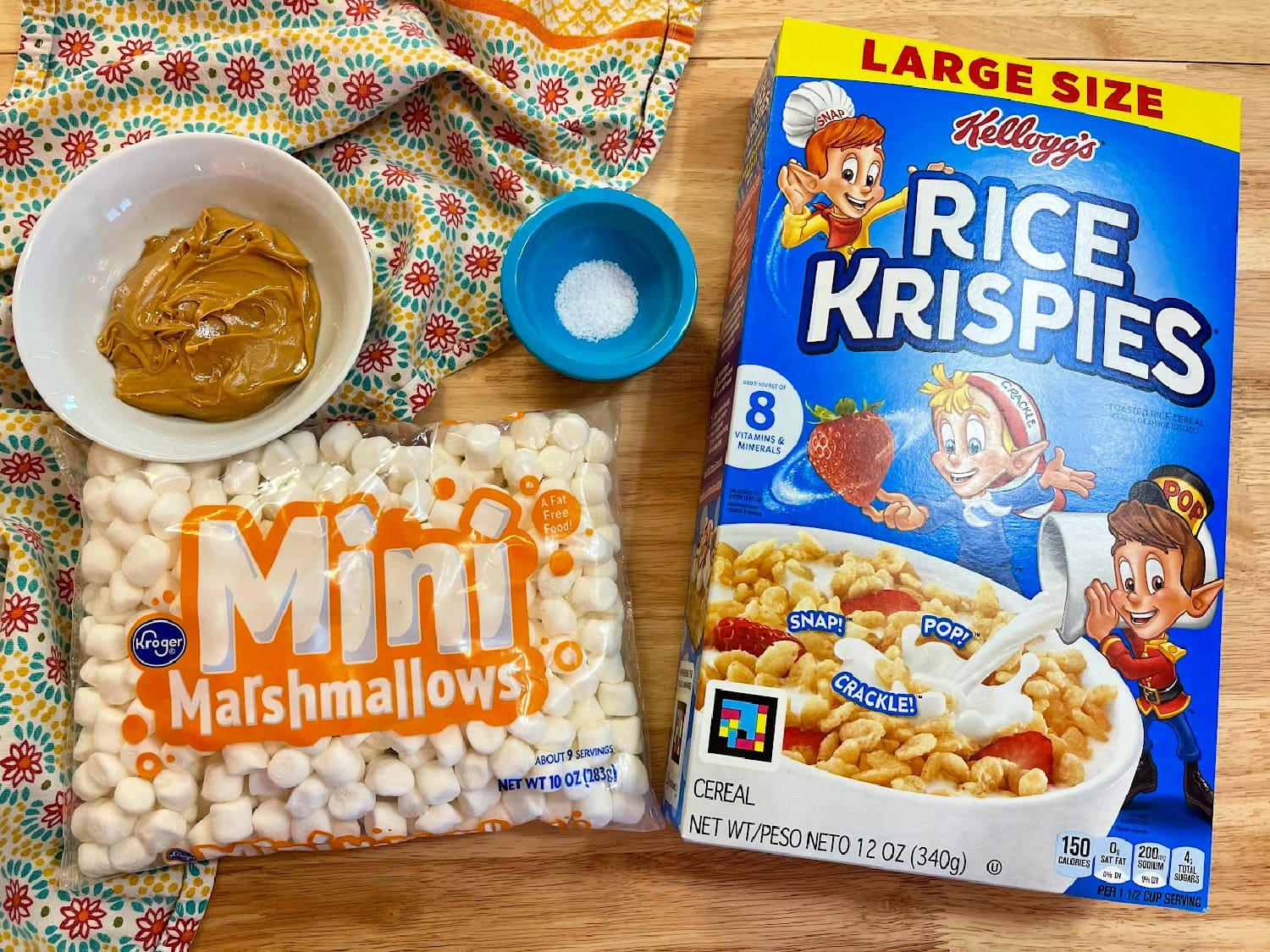 All the ingredients needed to make peanut butter rice krispie treats. 