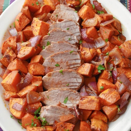 Pork Tenderloin Sheet Pan with Sweet Potatoes on a white serving plate.