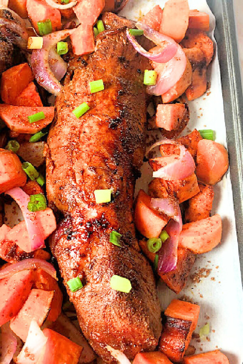 Easy pork tenderloin with sweet potatoes on a sheet pan with caramelized veggies. 