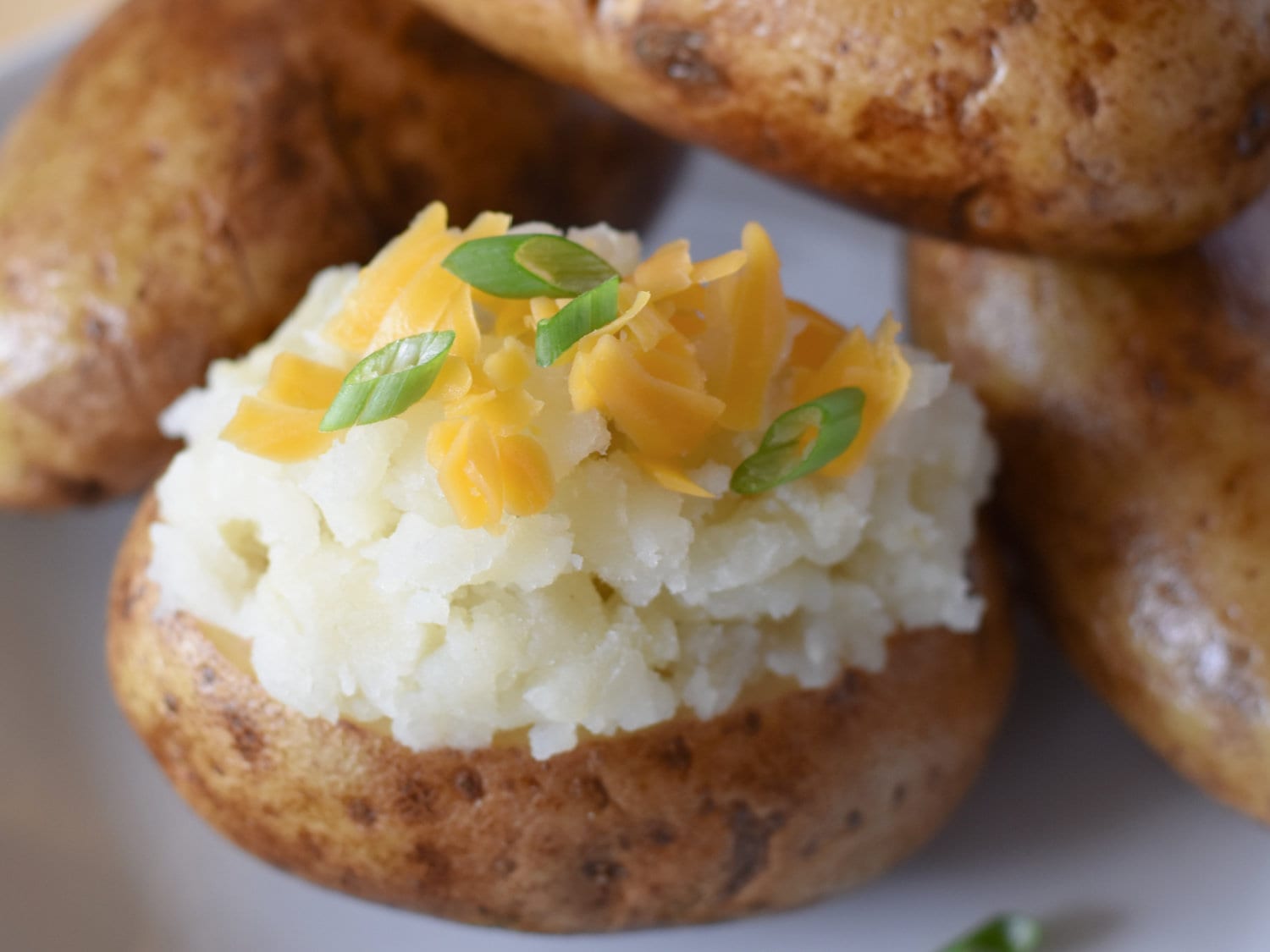 A loaded baked potato, hot and fresh from the electric roaster. 