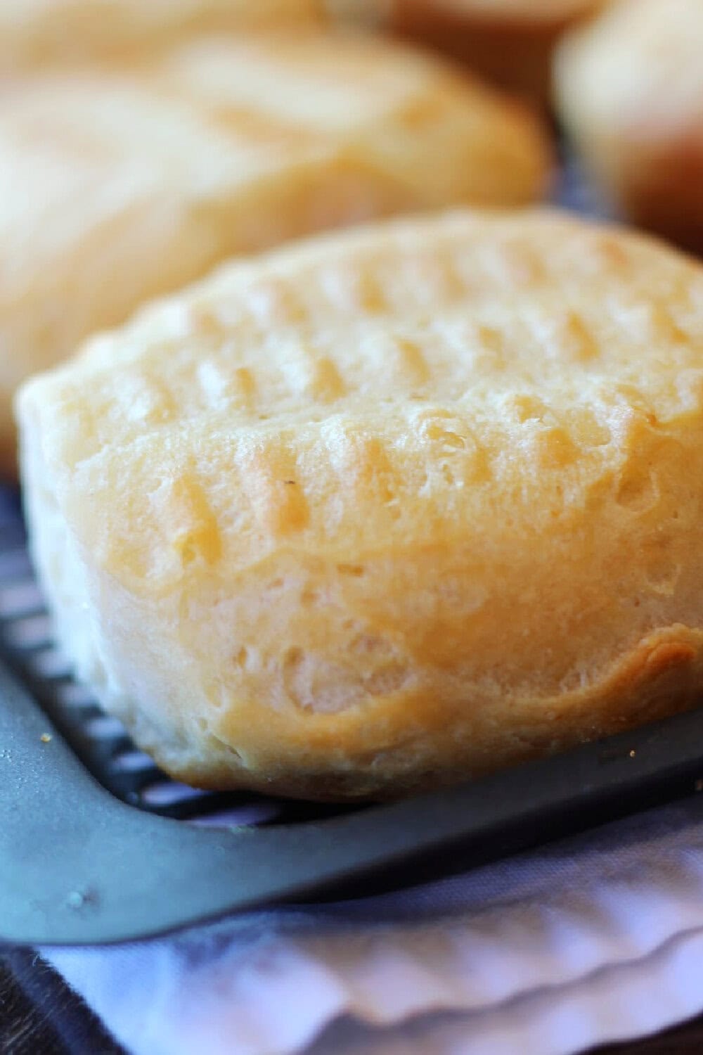 Half baked air fryer biscuits that have just been turned. 