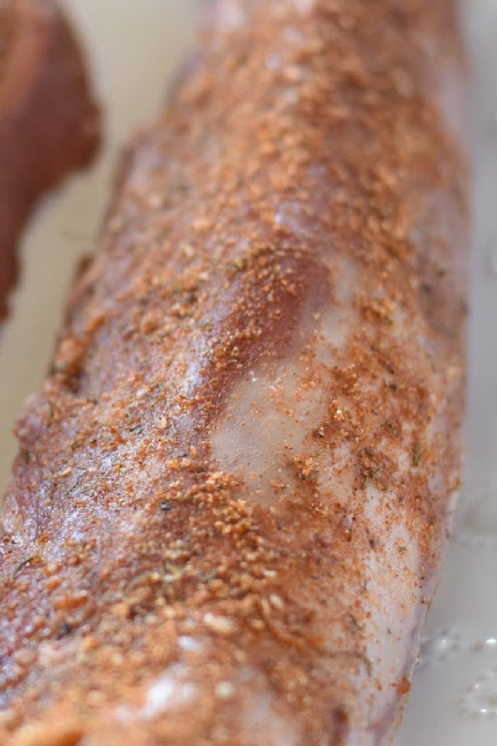 A seasoned pork tenderloin ready for the air fryer. 