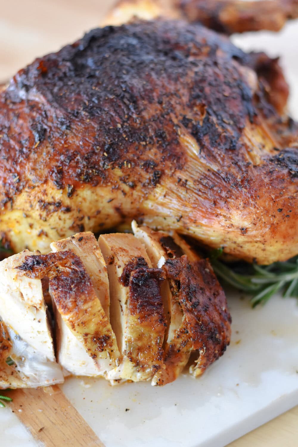 Freshly carved breast meat from an air fryer whole chicken. 