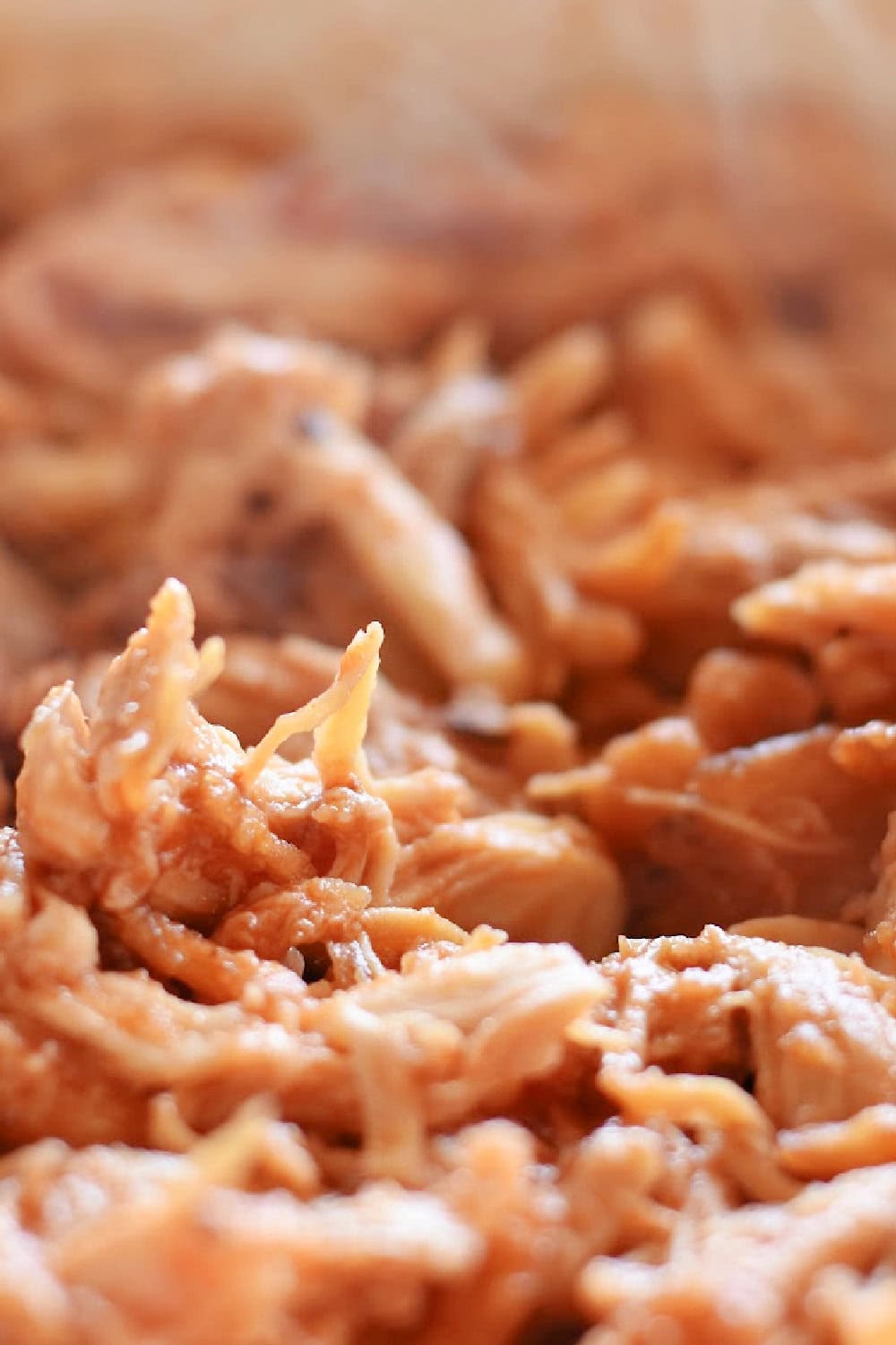 The warm BBQ Chicken mixture in a skillet for sliders. 