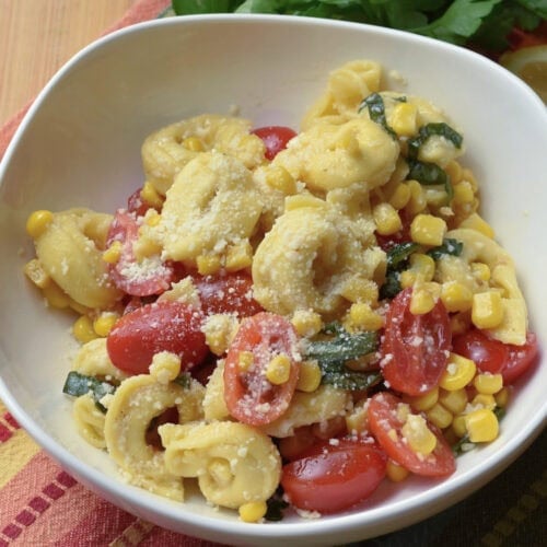 A bowl of tortellini pasta salad with cheese tortellini.