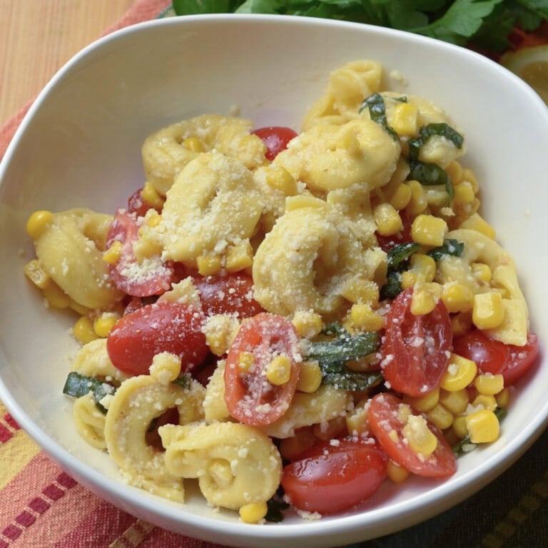 A bowl of tortellini pasta salad with cheese tortellini.