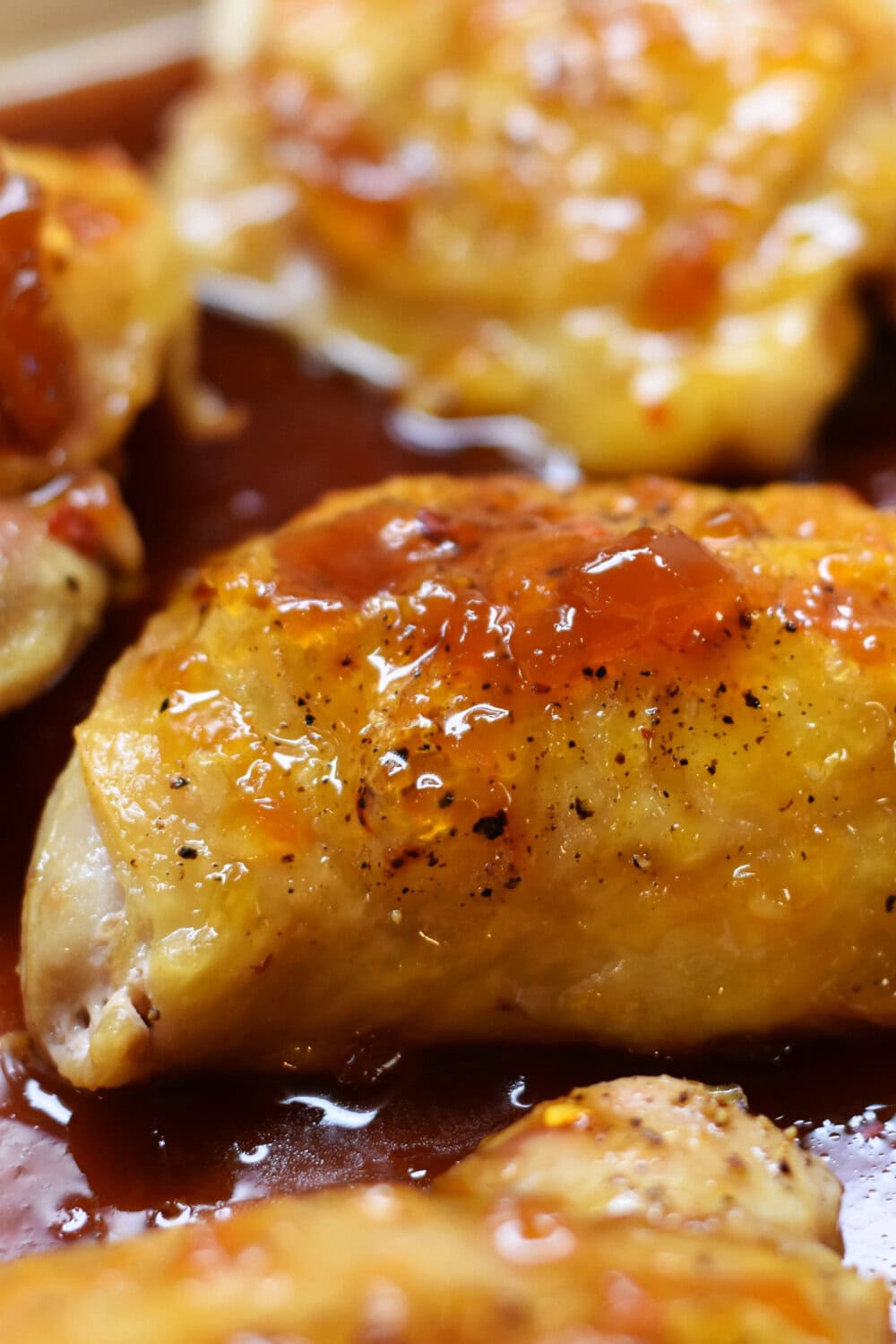 Apricot sauce poured over the chicken thighs. 