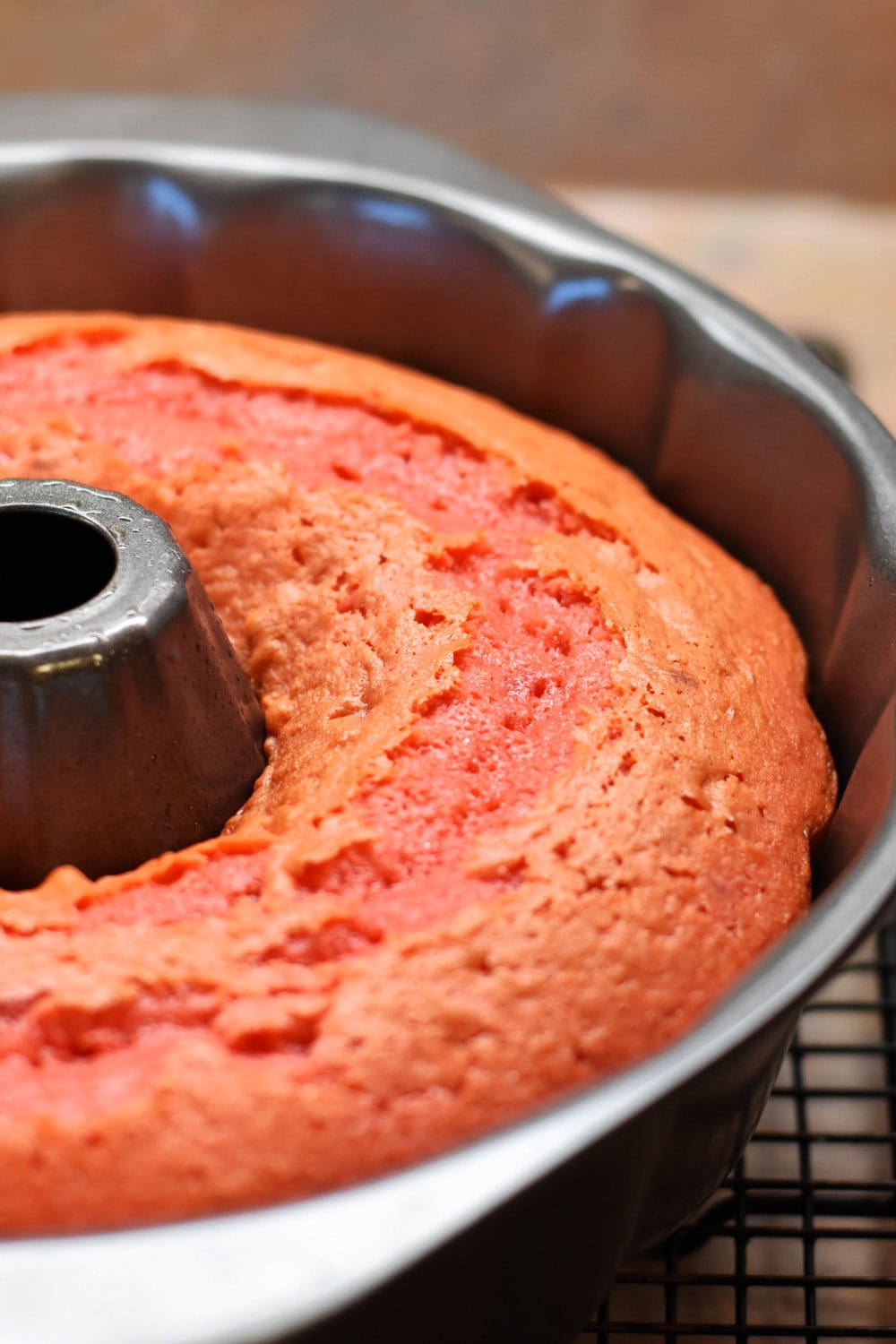 A fully baked pound cake still in the bundt pan. 