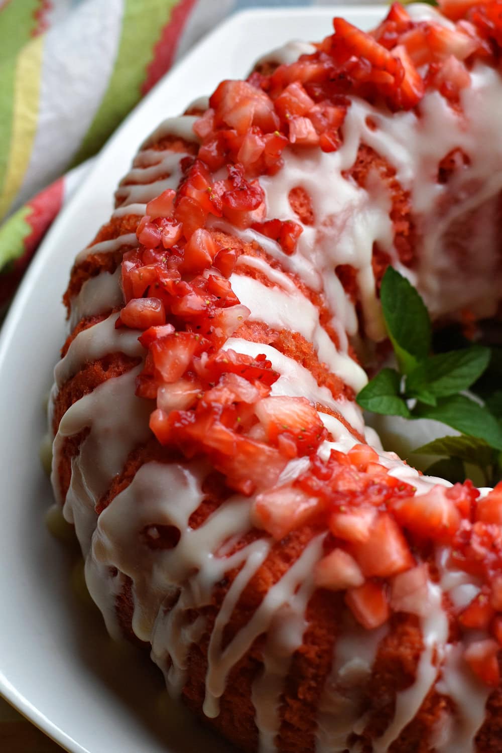 Strawberry Pound Cake with Vanilla Glaze and diced strawberries on top. 