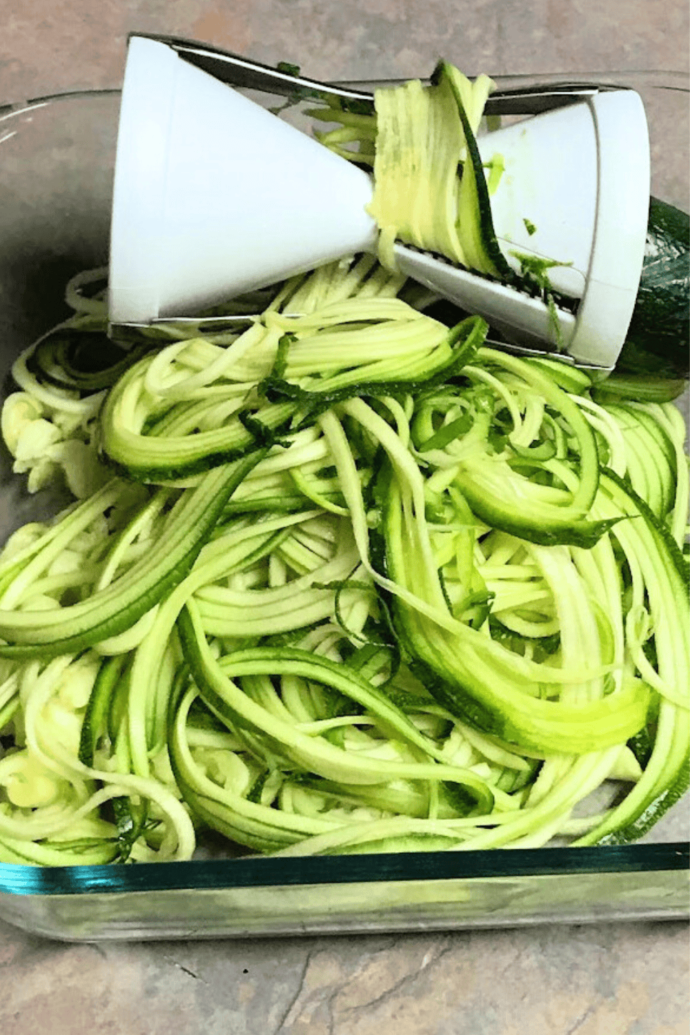 A zucchini spiralizer making zoodles. 