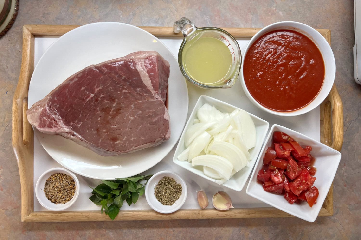 Beef bottom round roast with Italian tomato gravy ingredients. 