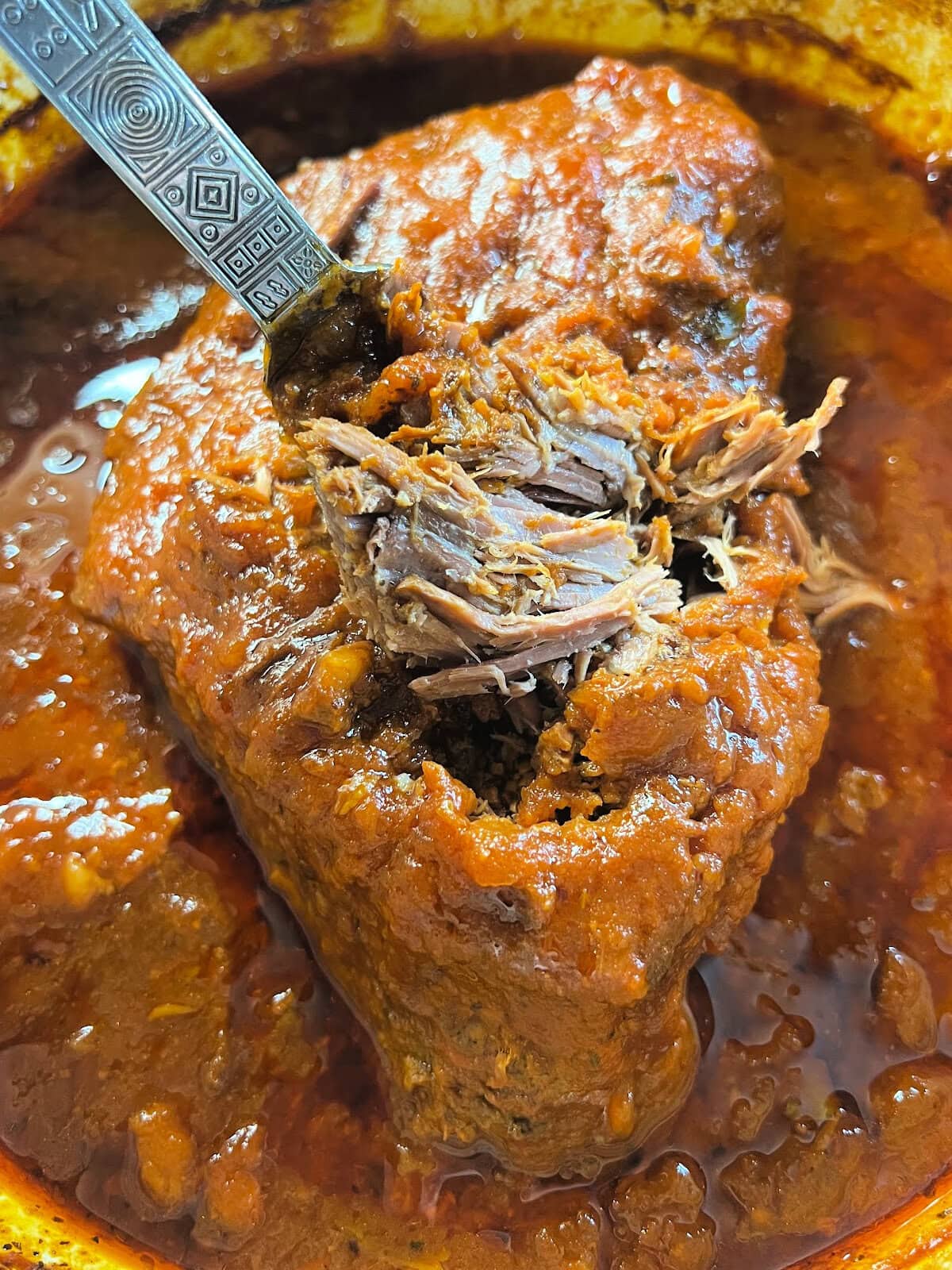 Slow roasted beef pot roast mad with a beef bottom round roast.