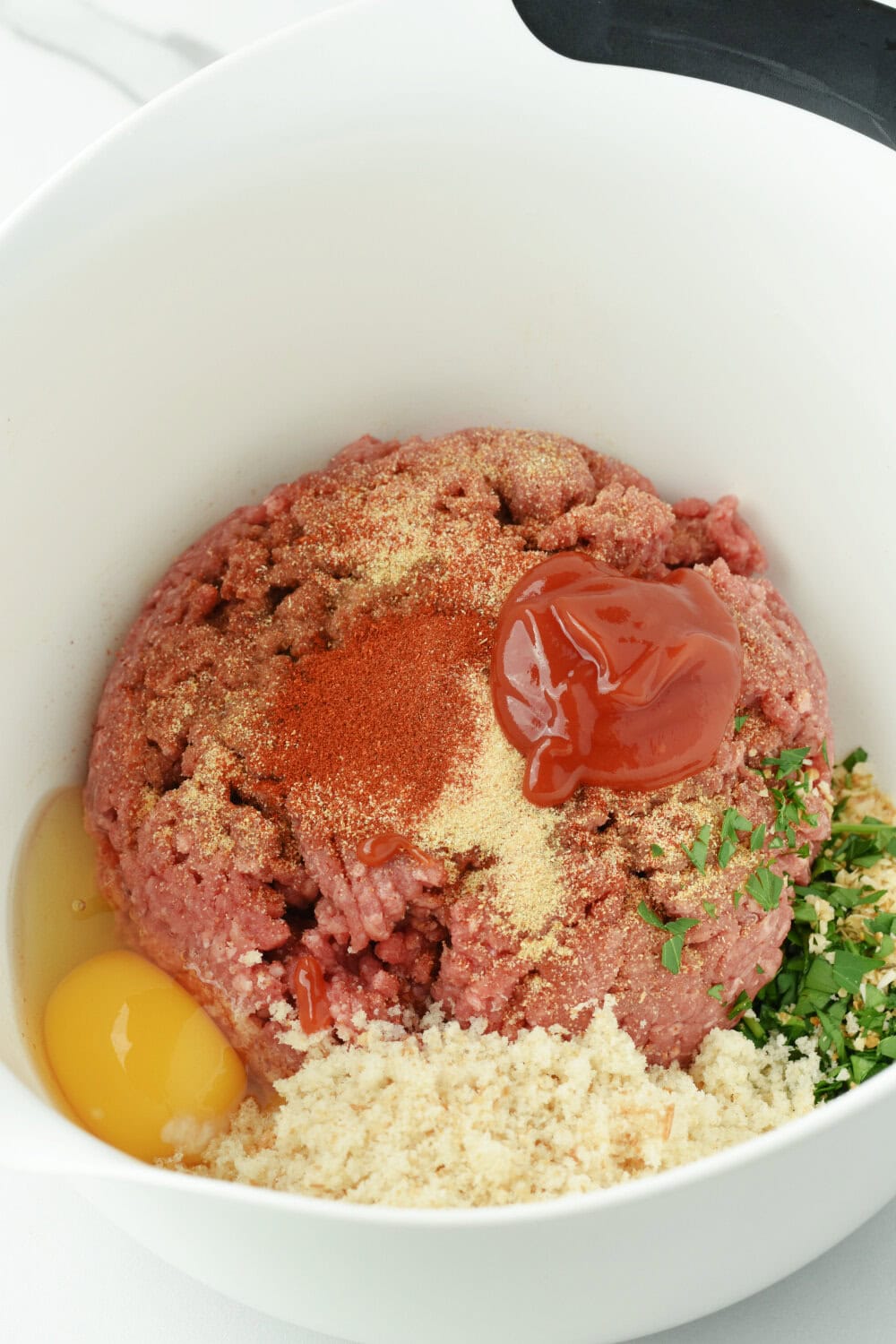 Meatloaf ingredients in a bowl. 