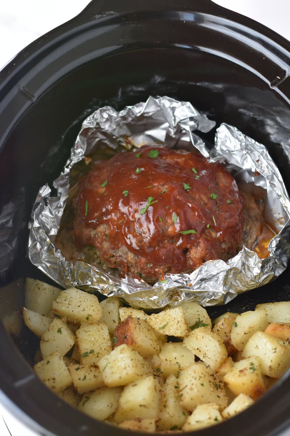 Crock Pot meatloaf cooked in foil with potatoes. 