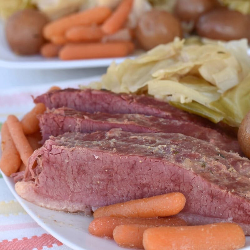 Sliced corned beef and cabbaged cooked in an electric roaster oven.