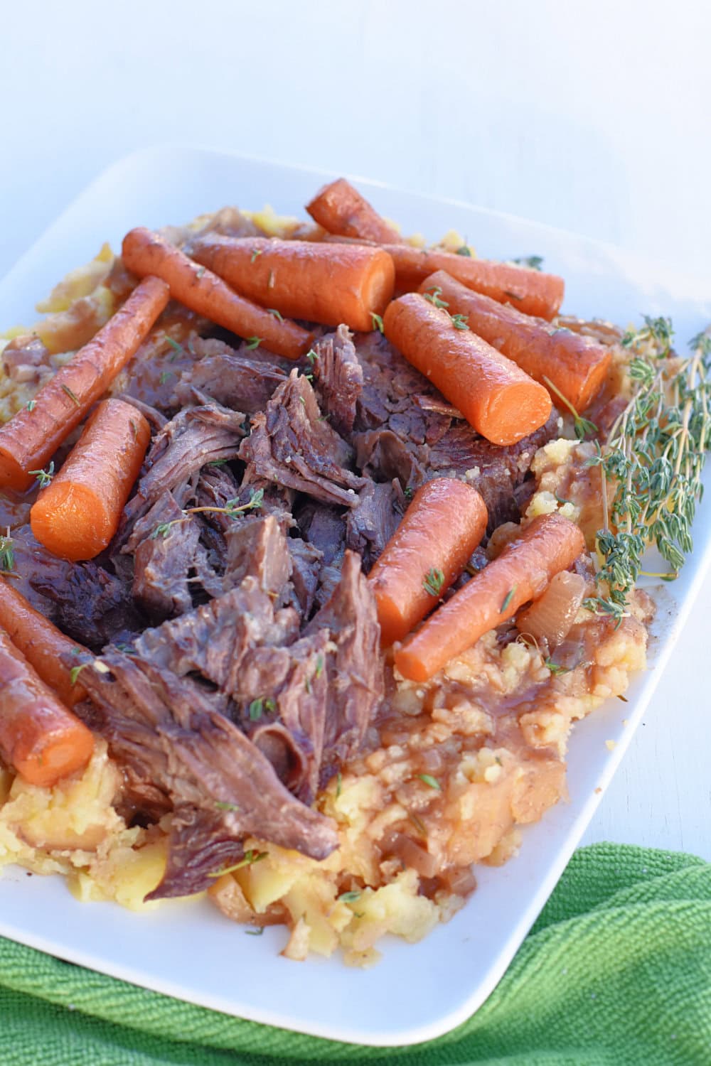 Red wine braised chuck roast with mashed potatoes and carrots. 