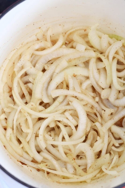 Sauted white onions in a dutch oven. 