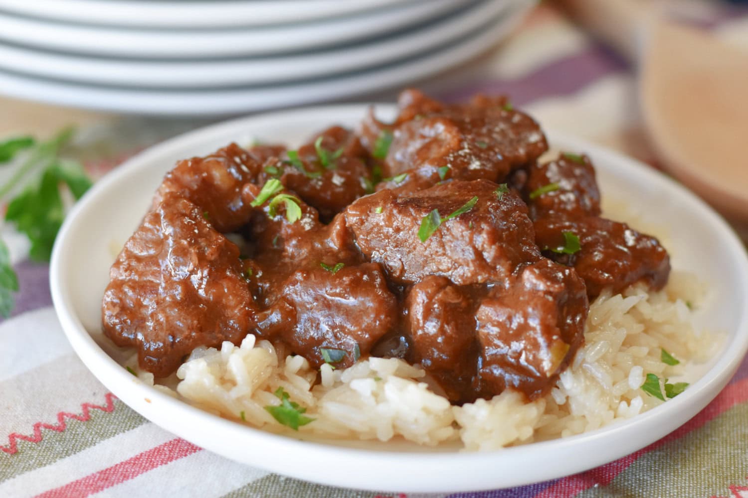 beef-tips-gravy-plate Beef tips and gravy over rice on a plate.