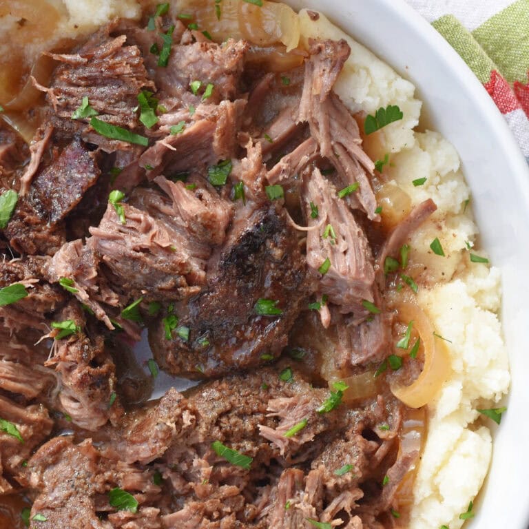 Braised arm roast recipes seared and then cooked in the oven in a dutch oven.