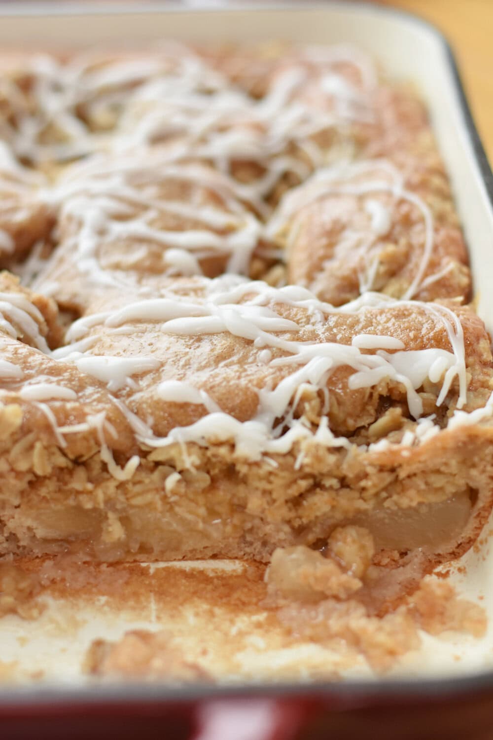 applesauce-crumb-cake-cut Applesauce crumb cake with apple pie filling with a piece cut out.