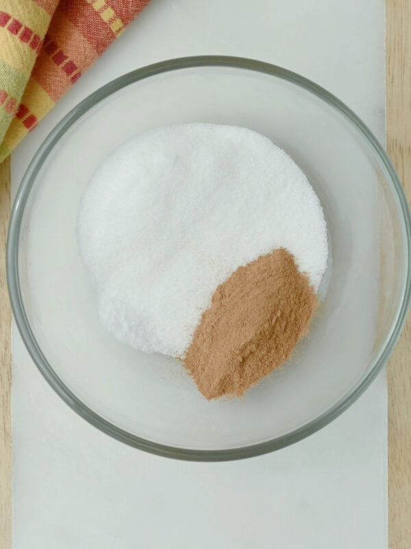 Cinnamon and granulated sugar in a bowl.