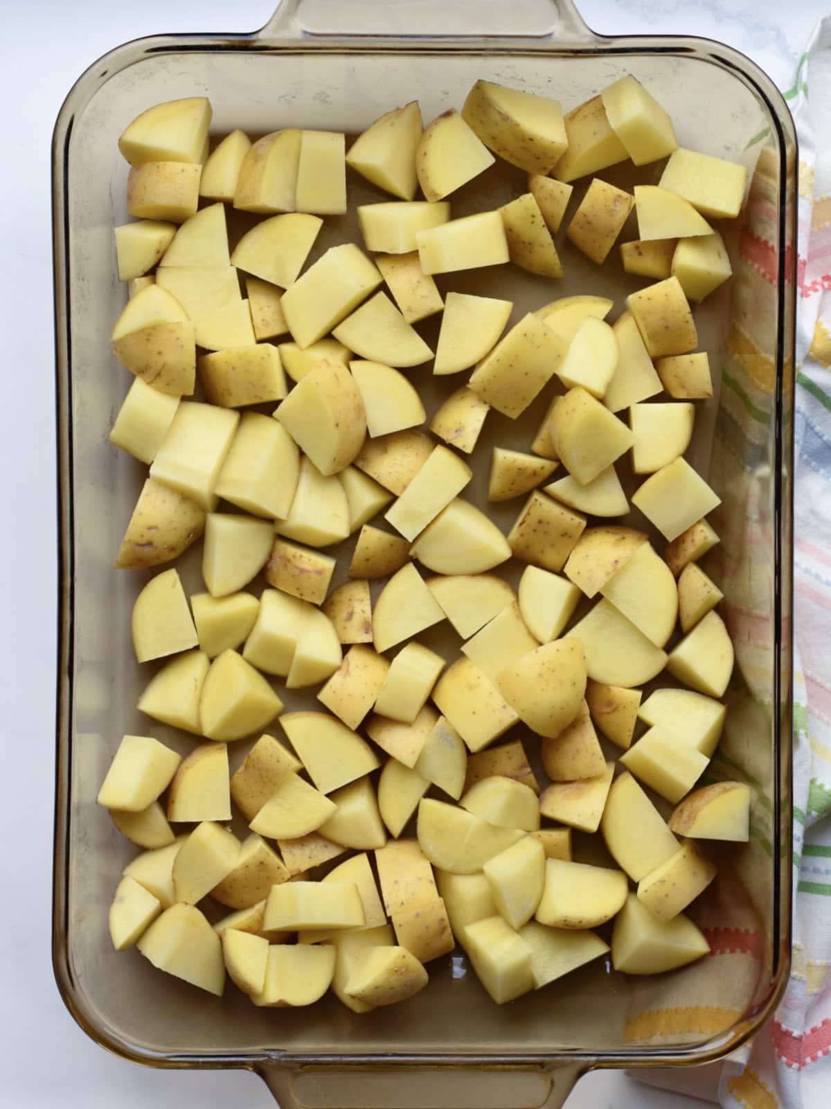 diced-yukon-potatoes Diced Yukon Gold in a 9X13 pan.