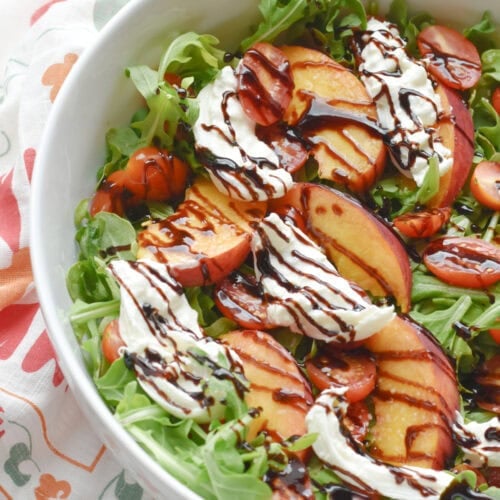 Peach Burrata Salad with arugula and balsamic glaze.
